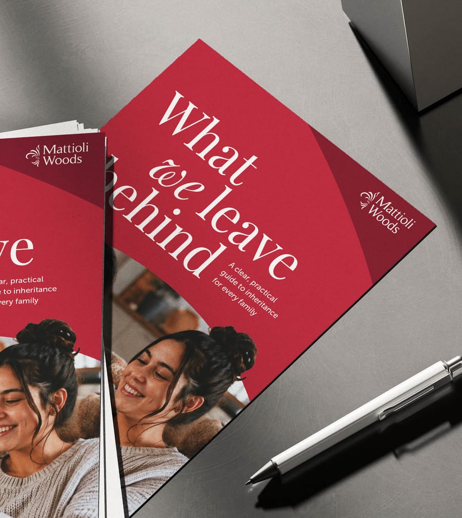 Mattioli Woods What We Leave Behind booklet covers close up desk shot with pen, print design by On Poynt Creative