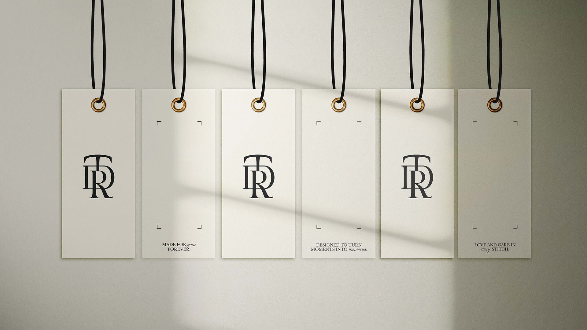 The Dressing Room Bridal hanging swing tags with monogram and 'Made For Your Forever' tagline, packaging design by On Poynt Creative
