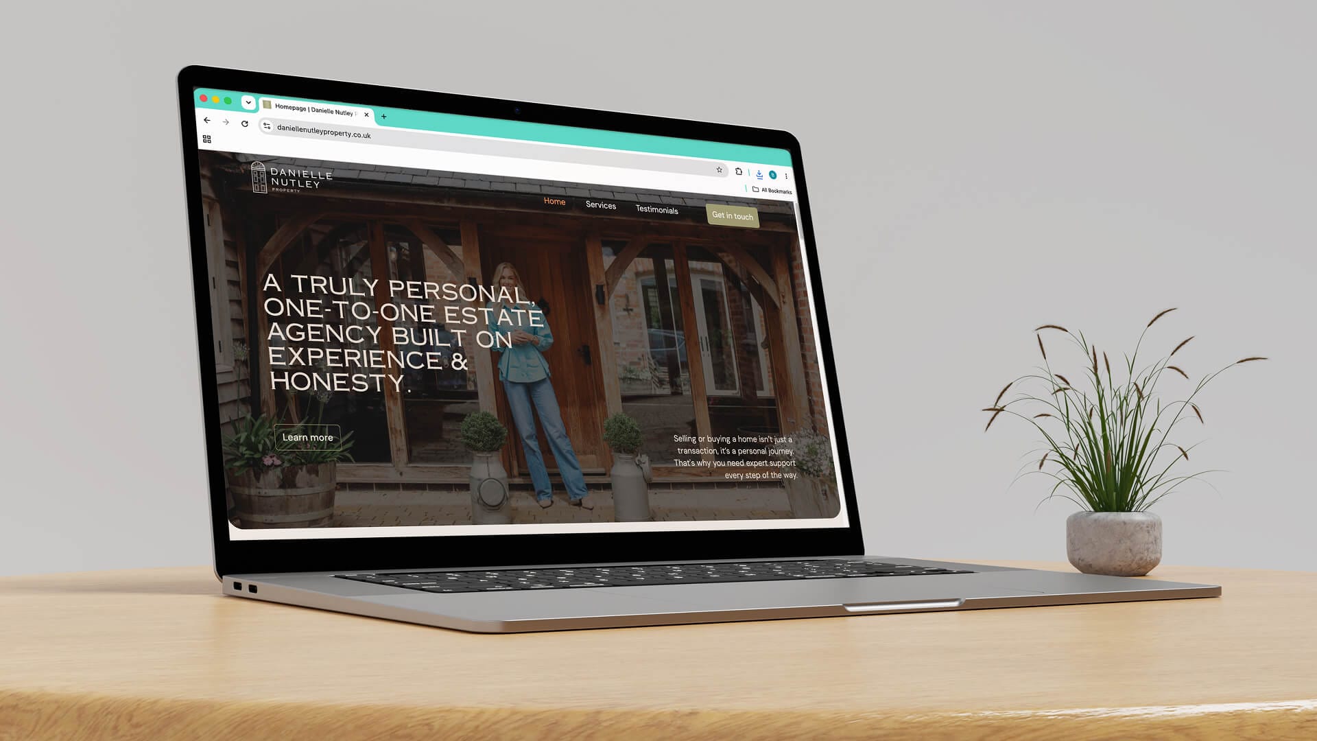 Danielle Nutley Properties laptop mockup showing homepage hero A Truly Personal One to One Estate Agency, web design by On Poynt Creative