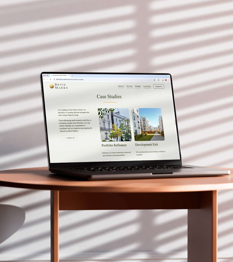 Bevis Marks website design on laptop by a sunlit window, by On Poynt Creative